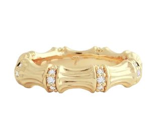 The Bamboo Single Ring by Anabel Aram is crafted in 18k gold with clusters of small round diamonds set between textured bamboo-inspired segments for a distinctive design.