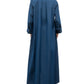 A person is shown from the back wearing TWP's Jenny's Cotton Gown, an oversized A-line maxi shirt dress in blue Italian cotton shirting, styled with black shoes against a plain white background.