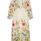 The Louisa Dress by Cara Cara is a long-sleeved, floral print maxi dress featuring a button-up front, high collar, and tie waist. It boasts a colorful garden-themed design with a subtle ruffled neckline for added charm.