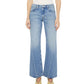 Model wearing "The Bookie Twist Skimp" high-waisted, wide-leg jeans in light blue by Mother, styled with beige pointed shoes; photographed from waist to feet against a white background.