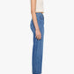 A woman stands in profile against a plain white background, wearing a short-sleeve white crop top, Mother’s Half Pipe Flood Cuff Fray high-waisted denim jeans with cuffed hems, and black wedge sandals.