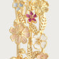 Close-up of the Anabel Aram Wildflowers Bangle, crafted in 18k gold and detailed with gold leaves and multicolored, hand-painted enamel flowers in white, pink, and purple.