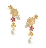 The Wildflowers Pearl Drop Earrings by Anabel Aram feature gold floral designs with small blue and pink accents, each finished with a dangling white pearl.