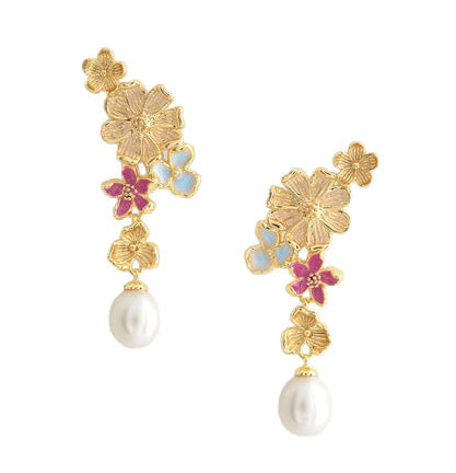 The Wildflowers Pearl Drop Earrings by Anabel Aram feature gold floral designs with small blue and pink accents, each finished with a dangling white pearl.