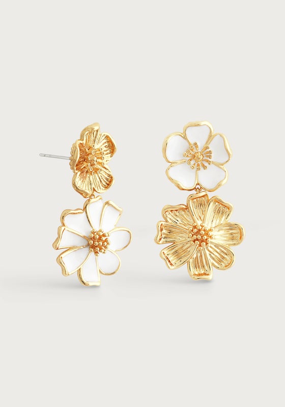 The Anabel Aram Wildflowers Mixed Drop Earrings feature three gold and white enamel flower shapes with detailed petals and textured centers, bringing a touch of nature-inspired elegance to your look.