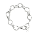 Anabel Aram Neptune Chain Bracelet featuring silver circular links connected by ribbed bar segments, finished with a lobster clasp and a small round charm.