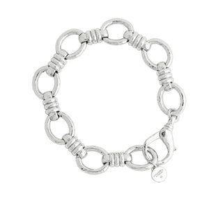 Anabel Aram Neptune Chain Bracelet featuring silver circular links connected by ribbed bar segments, finished with a lobster clasp and a small round charm.