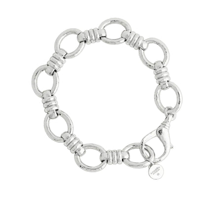 Anabel Aram Neptune Chain Bracelet featuring silver circular links connected by ribbed bar segments, finished with a lobster clasp and a small round charm.
