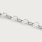 Anabel Aram Neptune Chain Bracelet in silver, featuring repeating oval links separated by ribbed cylindrical connectors.
