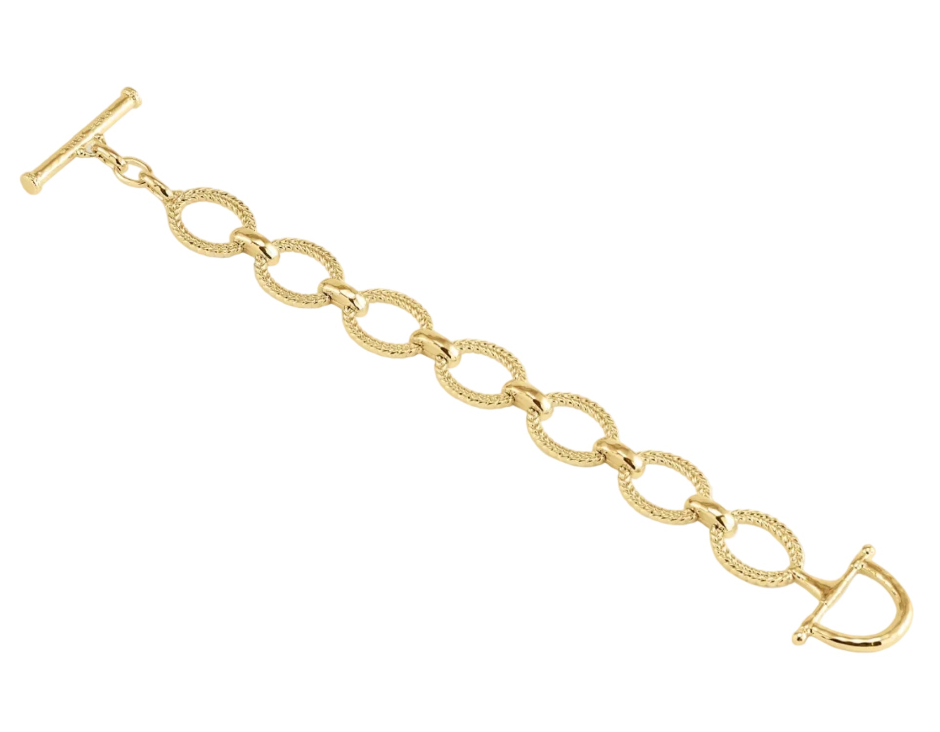 The Anabel Aram Cheval Chain Bracelet features gold-plated oval links with textured detailing, a T-bar clasp, and a D-shaped toggle closure, shown against a white background.