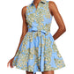 The Cara Cara Hannah Mini Dress by Cara Cara is a sleeveless, belted mini dress in blue with green and yellow floral patterns. It includes side seam pockets, offering both functionality and charm.