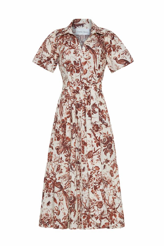 The Cara Cara Mardi Dress is a short-sleeved, collared midi dress with a button-down front and a brown and white botanical print.