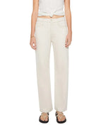 A person wearing off-white Dodger Skimp straight-leg jeans by Mother with a 31-inch inseam, sleeveless knotted top, and strappy sandals stands against a plain background.