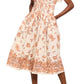 A person wearing the Cara Cara Nash Midi Dress—a light-colored, fit and flare shirt dress with a brown floral pattern and functional pockets—paired with tan open-toe sandals.