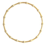The Anabel Aram Bamboo Necklace features segmented, crystal-studded bamboo-style sections crafted in 18k gold-dipped brass for a modern heirloom look against a white background.
