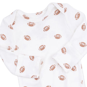 White baby onesie with long sleeves, crafted from soft ribbed modal fabric and adorned with an allover brown football print. Pair it with our Angel Dear Baby Boys’ Knotted Gown and Knotted Hat for a coordinated, complete look.