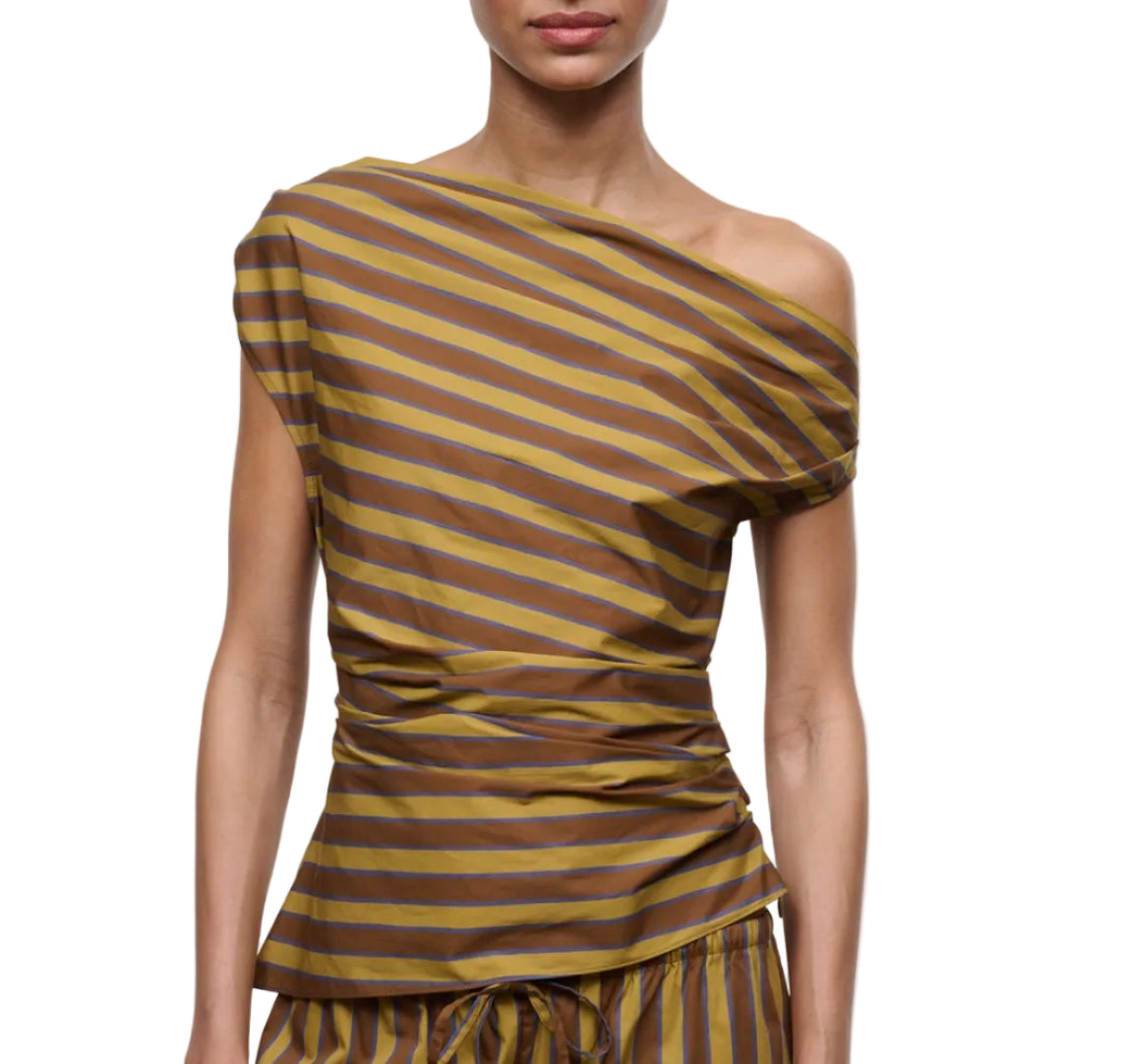 A woman wears the Staud Phare Top, an off-the-shoulder, short-sleeve brown and yellow striped top with a fitted, gathered waist, paired with matching bottoms.