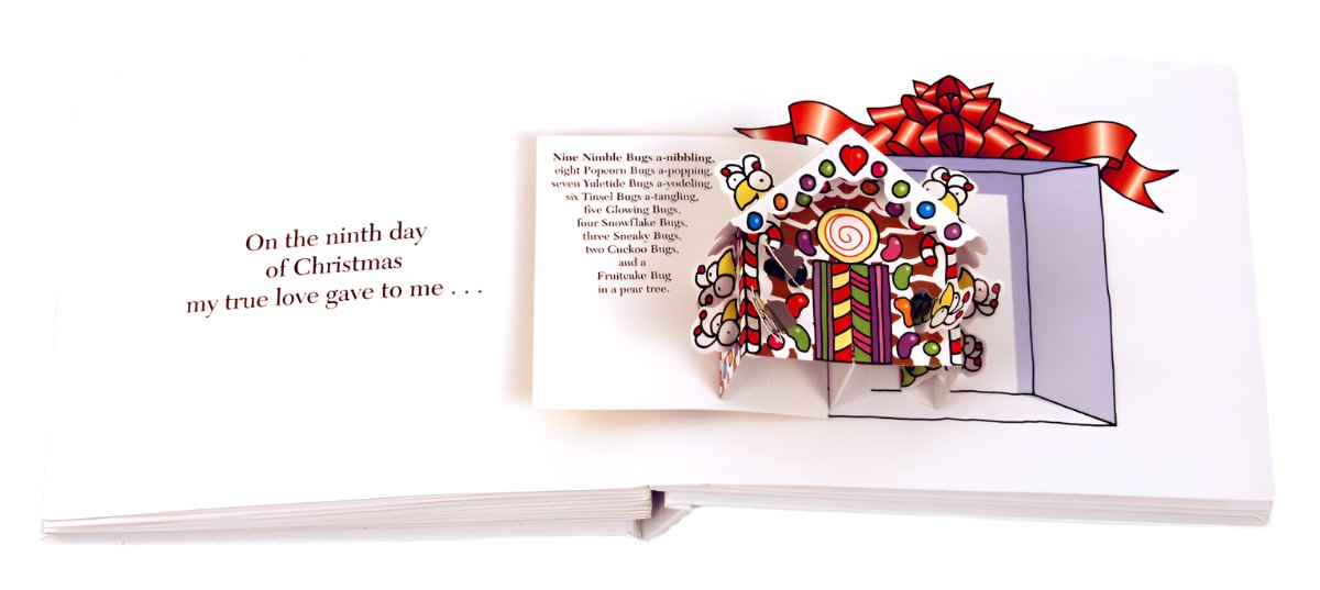 The pop-up book "12 Bugs of Christmas" by Simon & Schuster transforms into a delightful extravaganza featuring a vibrant gingerbread box illustration, with an excerpt from "The Twelve Days of Christmas" on the left page.