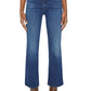 Shown from the waist down against a plain background, a person wears Mother’s The Hustler Ankle jeans with a white top and brown leather boots.