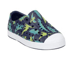 The Kids’ Jefferson Print Shoes from Native Shoes feature a navy slip-on design with a white toe cap, perforated holes, and an eye-catching green and blue dinosaur print on the upper. Made with shock-absorbent Sugarlite™ material, these shoes offer all-day comfort and durability.