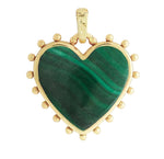 The Heart with Stone Charm by Anabel Aram features a green heart-shaped gemstone with gold accents and charming dot details around the edge.