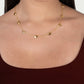 Anabel Aram Heart Station Necklace featuring a delicate 18k gold plated chain with evenly spaced, small puffy hearts worn around a person’s neck.