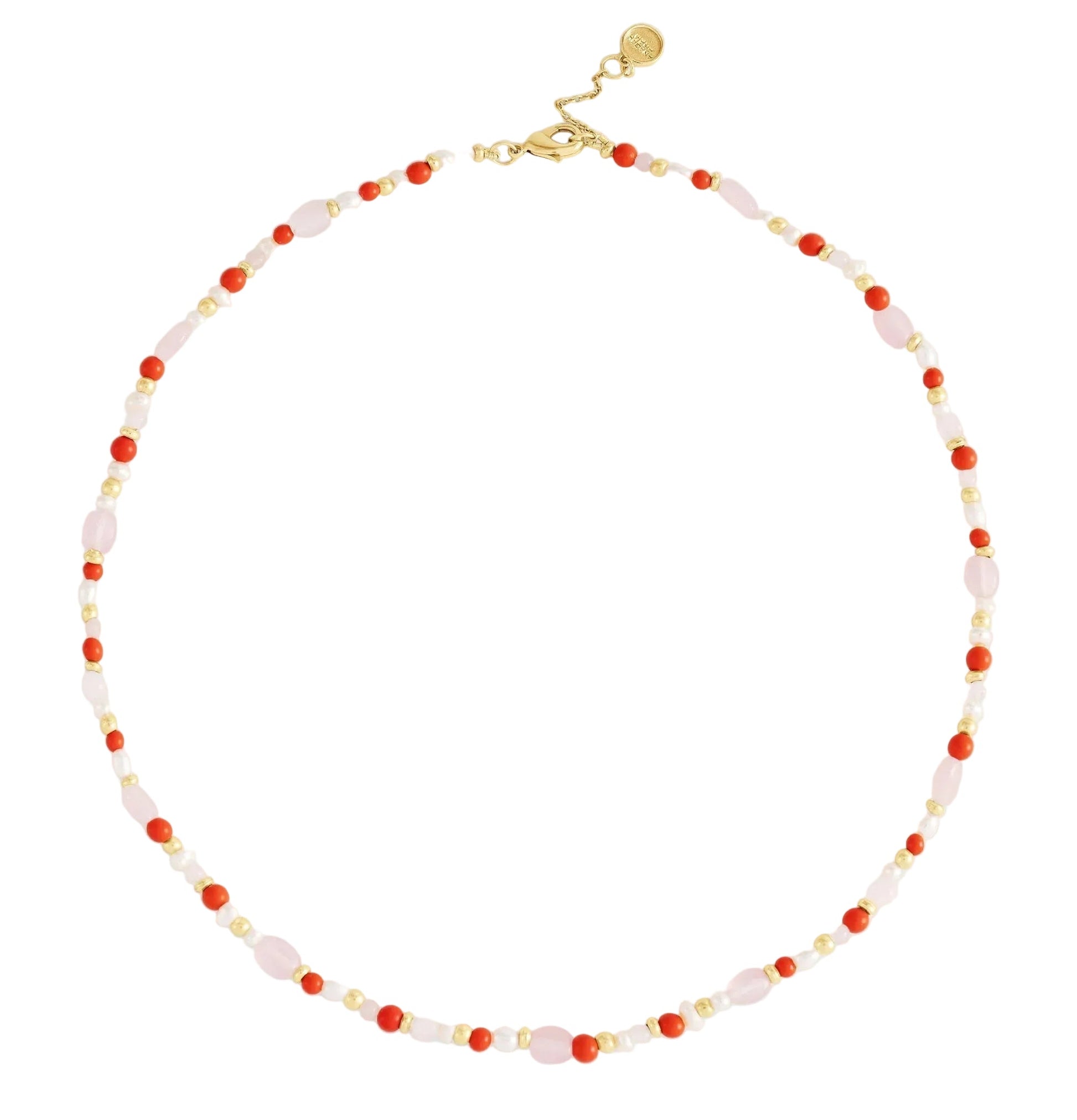 The Milos Beaded Necklace by Anabel Aram features alternating small red, pink, white, and turquoise beads with a gold clasp and adjustable extender.