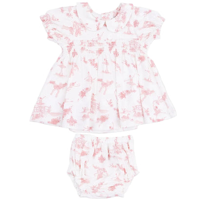 The Angel Dear Baby Girls’ Smocked Dress Set features a white dress with a pink toile pattern, short sleeves, and a charming Peter Pan collar, shown flat against a white background. This adorable set also includes matching bloomers for a timeless, classic look.