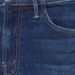 Close-up of the Mother Denim The Insider Ankle in dark-blue wash, highlighting a pocket, belt loop, and bronze button.