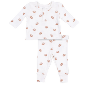 The Angel Dear Baby Boys’ Long Sleeve Henley Play Set features a soft ribbed modal fabric and includes a long sleeve henley top and matching pants, both in white with an allover brown football print for cozy, easy dressing.