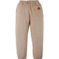 The Boys’ Giulio Jogger Pants by Gingersnaps feature a beige fleece design with an elastic waistband and cuffs, a single back pocket on the right side, and a small red logo patch above the pocket, shown against a white background.