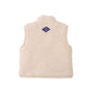 The Gingersnaps Baby Orazio Sherpa Vest is pictured from the back in a cream-colored plush fabric, highlighted by a small blue and red diamond-shaped patch near the collar—ideal for layering babies on chilly days.