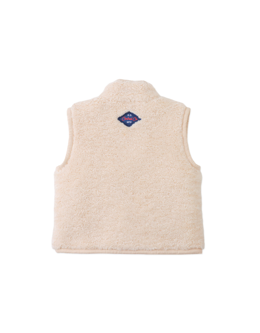 The Gingersnaps Baby Orazio Sherpa Vest is pictured from the back in a cream-colored plush fabric, highlighted by a small blue and red diamond-shaped patch near the collar—ideal for layering babies on chilly days.