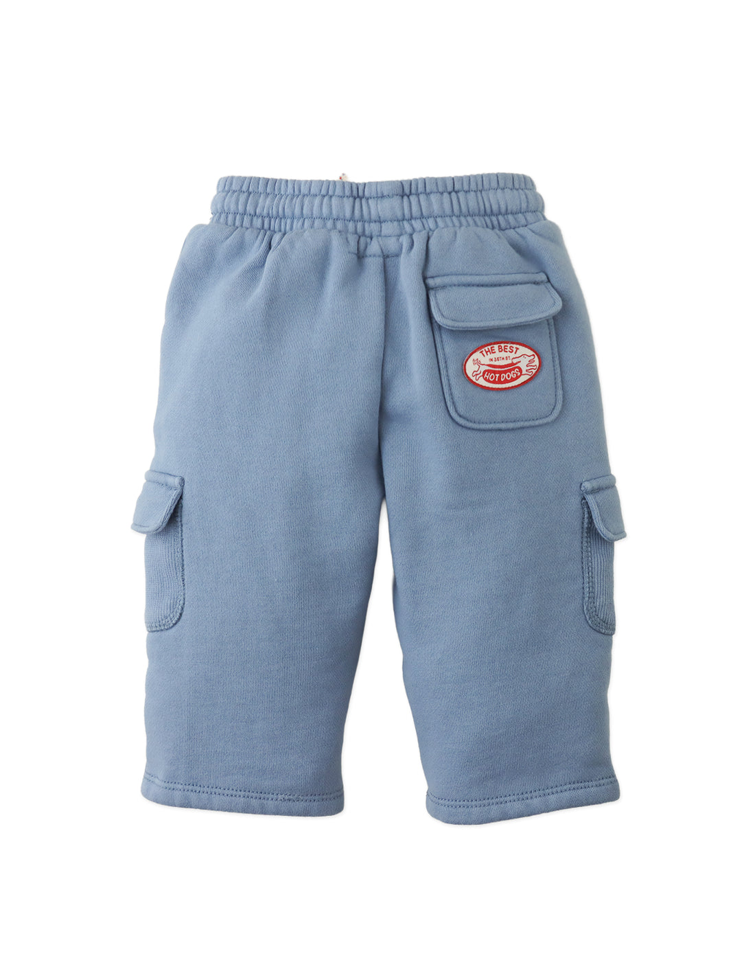 The Gingersnaps Baby Boys’ Valentino Cargo Jogger Pants feature a light blue design with an elastic waistband, side pockets, convenient extra pockets, and a “Super Best Sport Cop” patch on the left thigh for a comfortable and stylish look.