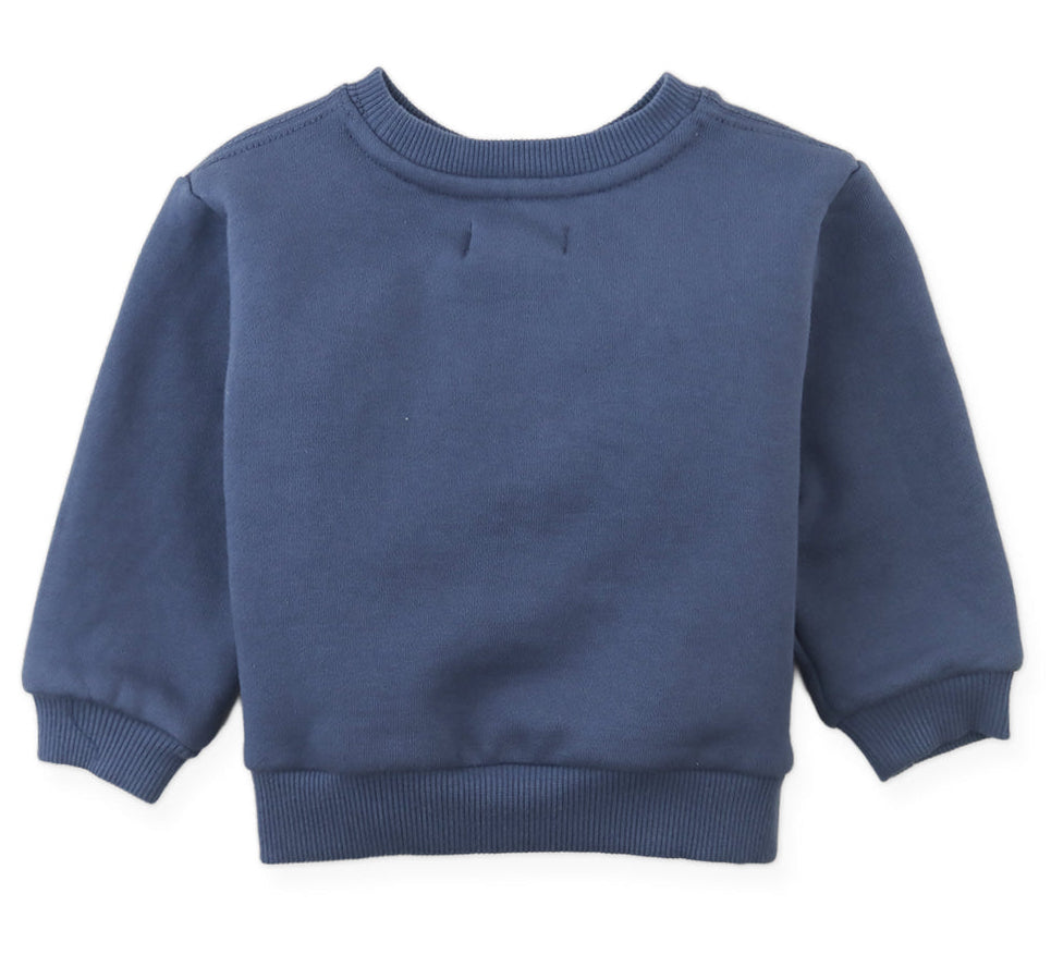 The Gingersnaps Baby Boys’ Riccardo Pullover is displayed flat with its front side visible, showcasing ribbed cuffs, waistband, and collar. This cozy navy blue fleece sweatshirt features a charming embroidered dachshund for a playful accent.