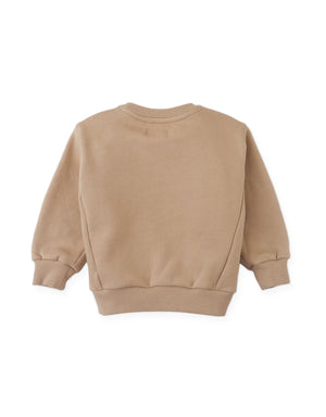 The Baby Boys’ Ennio Pullover by Gingersnaps is displayed from the back in beige, featuring ribbed cuffs and waistband. Crafted in a soft fleece pullover style, this long-sleeve crewneck essential is laid flat on a white background—perfect for effortless street-style looks.