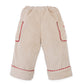 Gingersnaps Baby Girls’ Nellie Pant with Poodle Pocket features a beige design with red-trim accents, an elastic waistband, large side pockets including a playful poodle pocket, and cuffed hems for comfy straight-leg style for little ones. Shown on a white background.