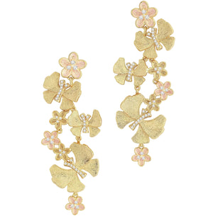Anabel Aram's Butterfly with Flowers Dangle Earrings feature cascading 18k gold butterflies with delicate flower designs and pink and white accents.