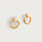 The Anabel Aram Neptune Triple Ring Earrings, minimalist gold studs with a triple ring design, are shown against a plain white background.