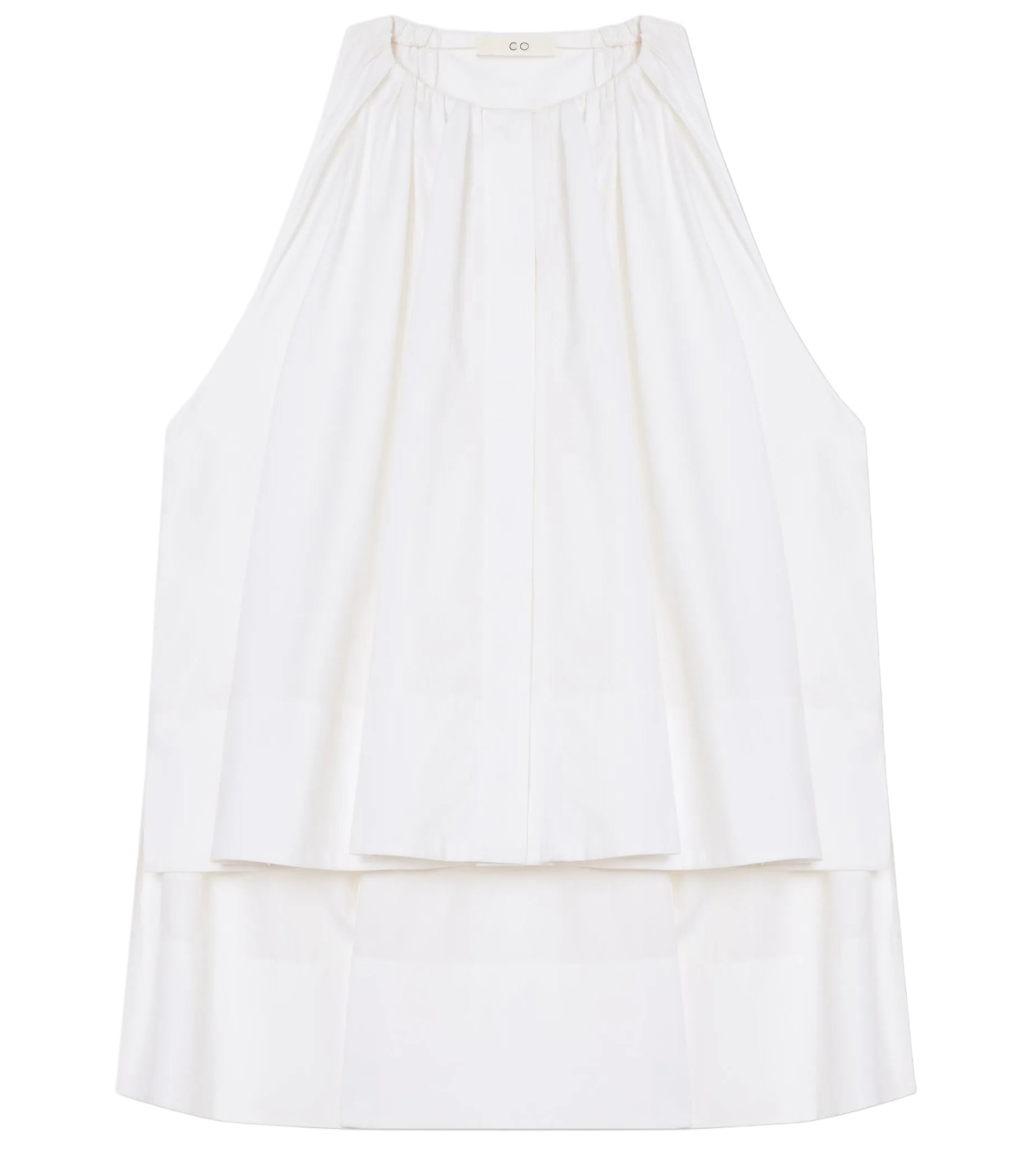 The Gathered Tunic Shirt by CO is a sleeveless white cotton poplin shirt featuring a high neckline, pleated front, and layered hem, shown laid flat on a white background.