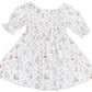 The Angel Dear Baby Girls’ and Girls’ Jennifer Dress and Bloomer features puffed sleeves, a smocked bodice, and a charming woodland animal and floral print. Crafted from soft bamboo fabric for ultimate comfort, this adorable ensemble includes a matching bloomer, making it perfect for children.