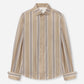 Standing Collar Silk Shirt by CO, featuring an oversized fit and vertical white, brown, and gray stripes on beige silk with elegant horn button detailing, laid flat on a white background.
