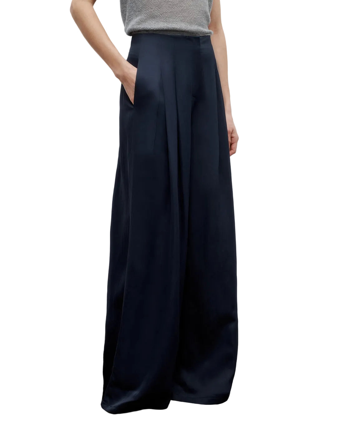 Model wearing the TWP Drew Coated Viscose Linen Pant in navy, featuring a high-rise wide leg silhouette with pockets, paired with a light grey sleeveless top. Image shown from shoulders to feet.