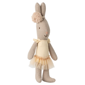 The Maileg Rabbit, Micro - Ballet Suit & Skirt Cream is a plush toy dressed in a cream ballet outfit with skirt, standing upright like a graceful dancer.