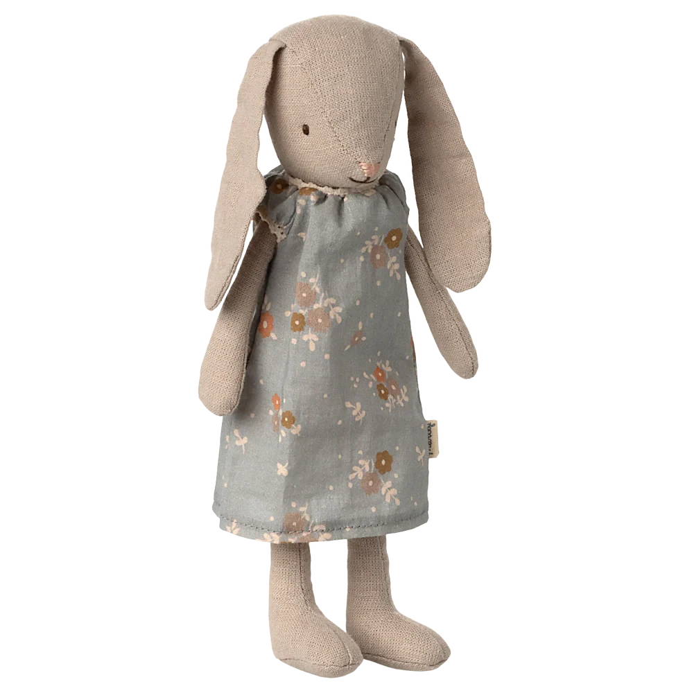 The Maileg Bunny, Size 1 - Classic - Dress features a soft bunny with long floppy ears, embroidered eyes and nose, and a grey floral dress made from natural fabrics, shown standing upright against a plain background.