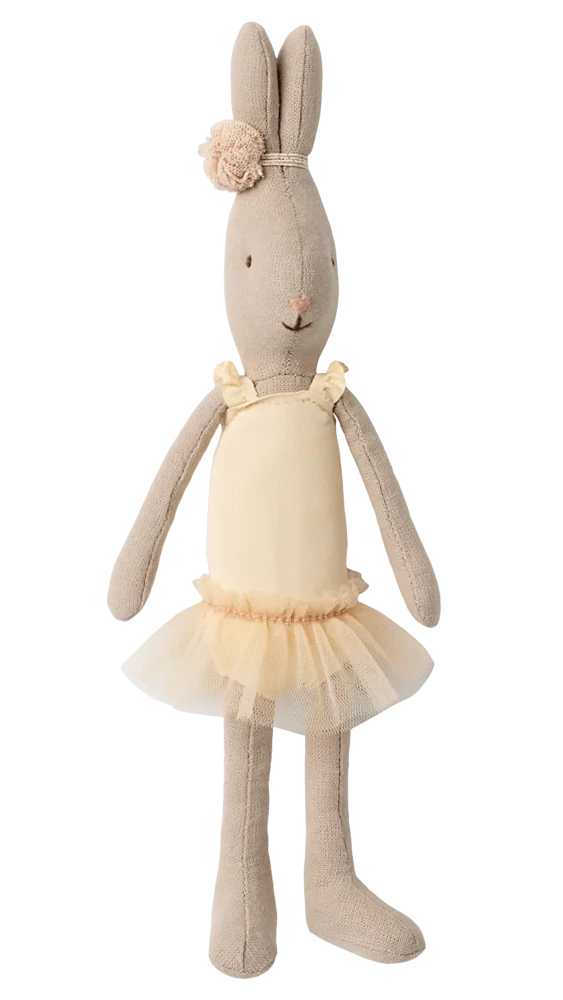 The Maileg Rabbit Size 1, Classic, is standing upright against a plain white background, dressed in a cream ballet suit with a matching tulle skirt and a floral headband, reminiscent of a tiny ballerina.