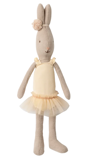 The Maileg Rabbit Size 1, Classic, is standing upright against a plain white background, dressed in a cream ballet suit with a matching tulle skirt and a floral headband, reminiscent of a tiny ballerina.