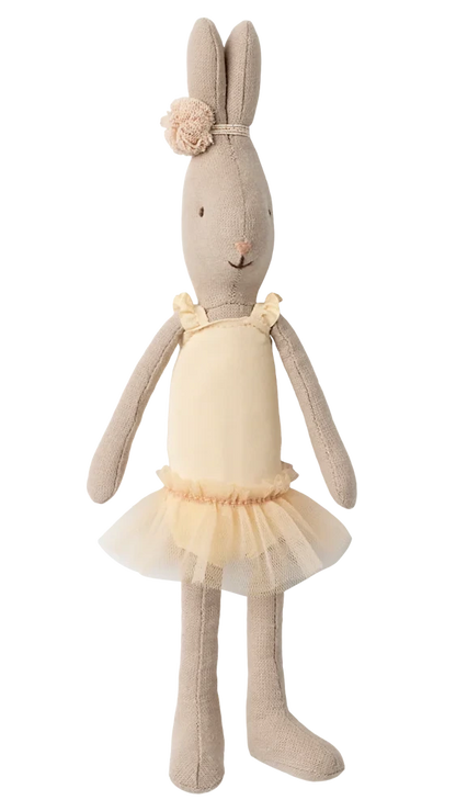 The Maileg Rabbit Size 1, Classic, is standing upright against a plain white background, dressed in a cream ballet suit with a matching tulle skirt and a floral headband, reminiscent of a tiny ballerina.