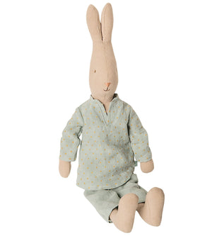 The Maileg Rabbit Size 3, Pajamas by Maileg is adorned in cozy sleepwear featuring a light blue shirt with tiny yellow dots and matching pants, all while sitting upright.