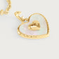 Anabel Aram Heart Radiant Charm featuring a gold-rimmed iridescent inlay with a raised gold heart in the center, attached to a gold chain link.